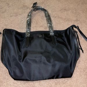 Botkier tote bag new, never used. Still has tag and handle covers.